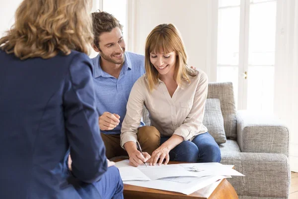 young-couple-owners-signing-a-contract.jpg
